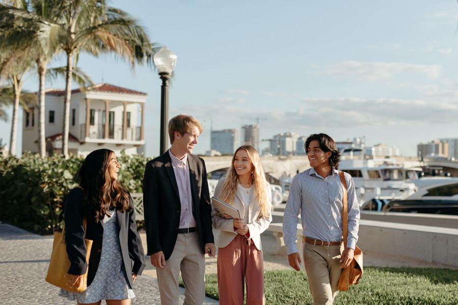 master of business administration mba students walk near the intercoastal waterway in 西<a href='http://ae.shanemichaelmurray.com/'>推荐全球最大网赌正规平台欢迎您</a>.